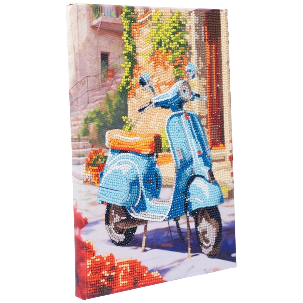 Nice - Diamantiny Artist Level Up Painting on Canvas packaging features a glossy design with a blue moped on a brick sidewalk