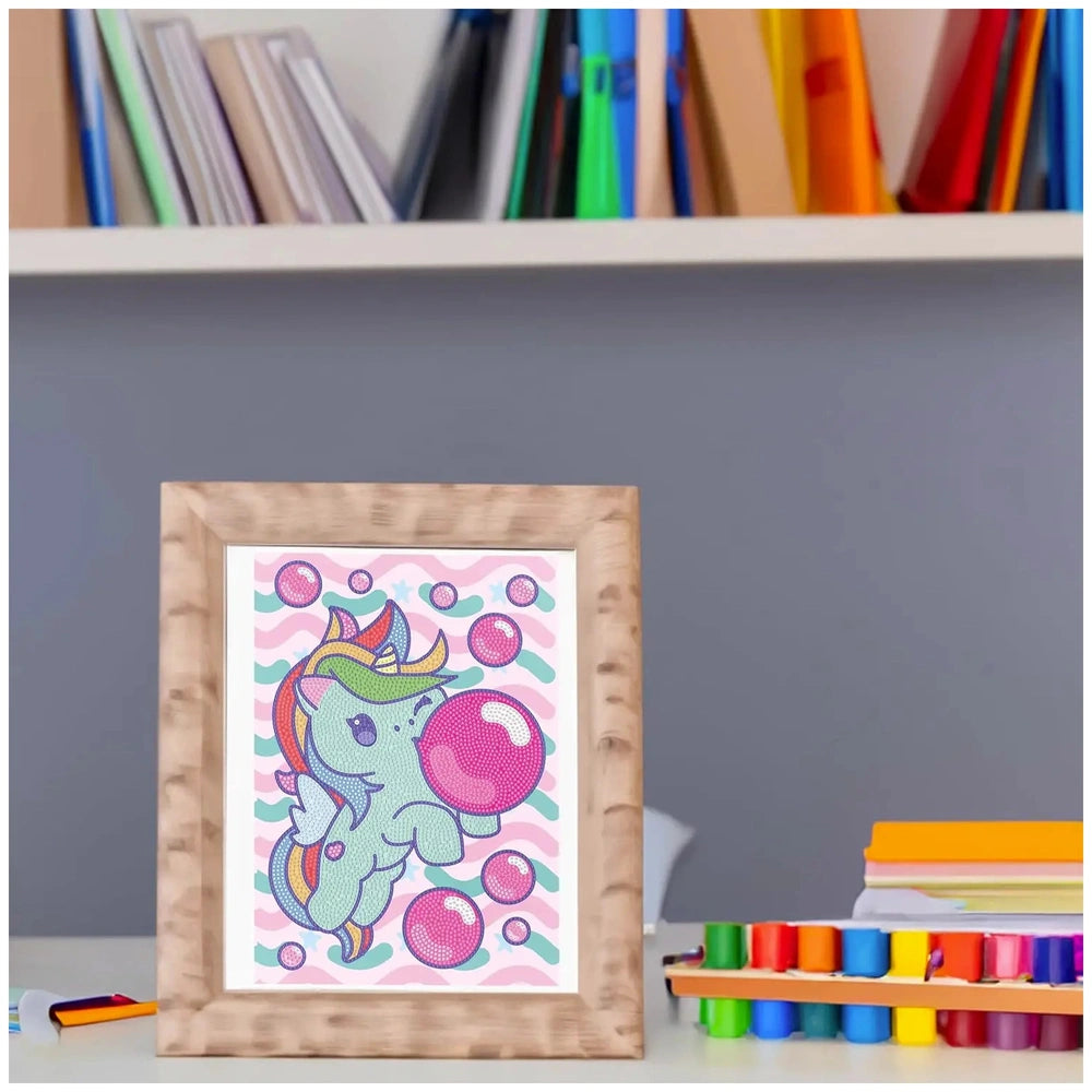 Diamantiny Crystal Art Design Set features a framed unicorn with balloons on a pink striped background.