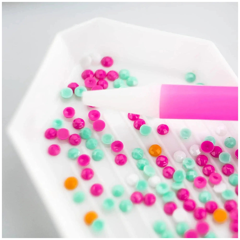 Diamantiny Crystal Art Design Set featuring pink, orange, and blue beads with a pink and white marker in a close-up layout.