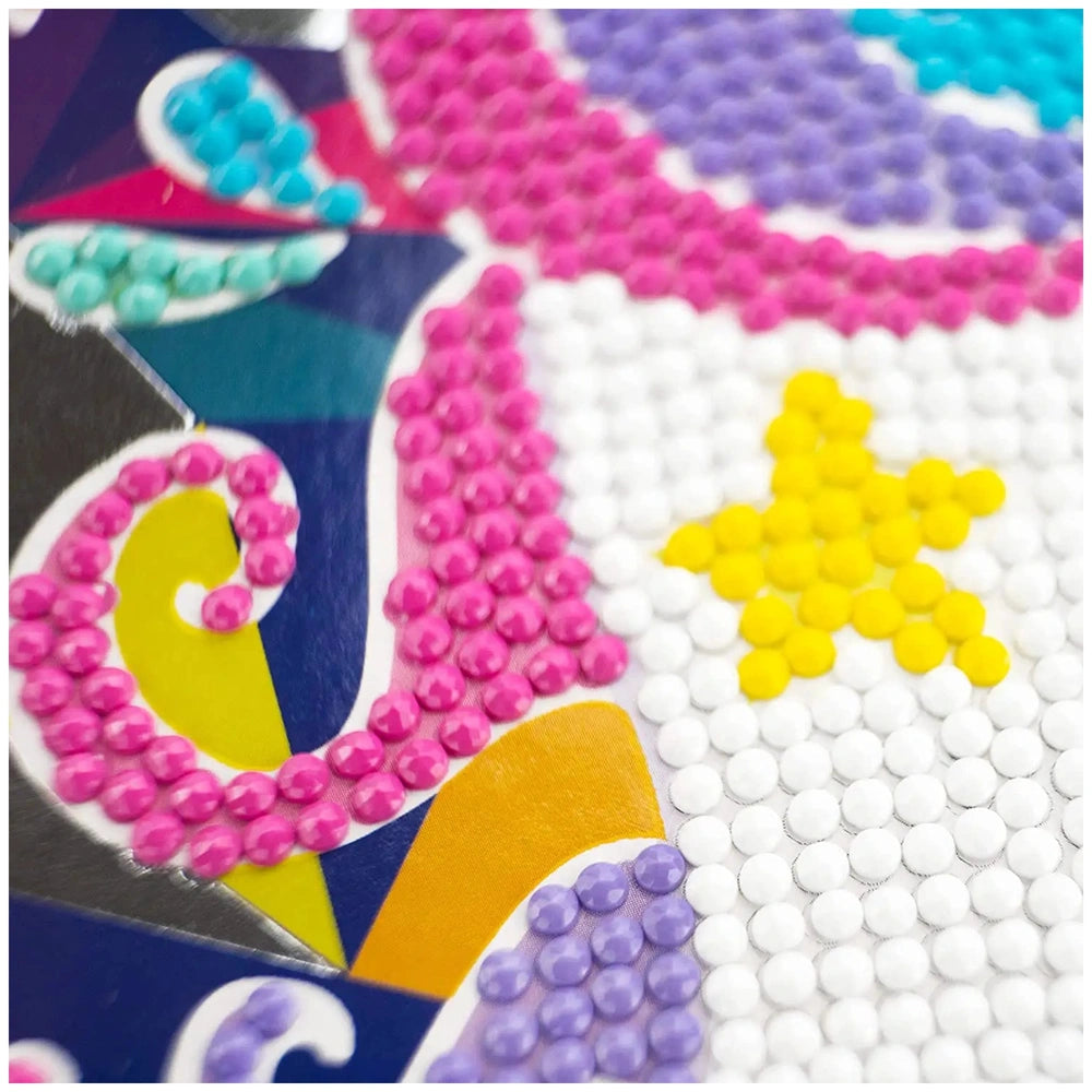 Diamantiny Crystal Art Design Set features glossy pink, yellow, and purple plastic balls arranged in a colorful layout.