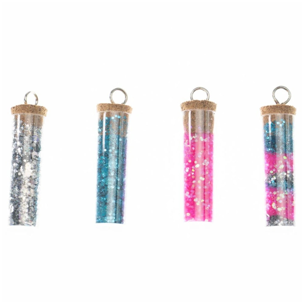 Diamantiny Deco Charms Set features three cylindrical glossy plastic containers in silver, blue, and pink with cork-like caps