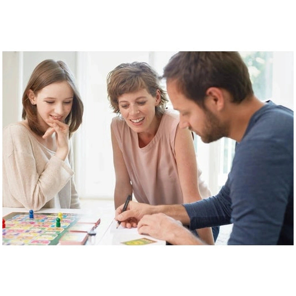 PIATNIK Activity Compact board game being played on a reflective table by three casually dressed individuals with colorful ga