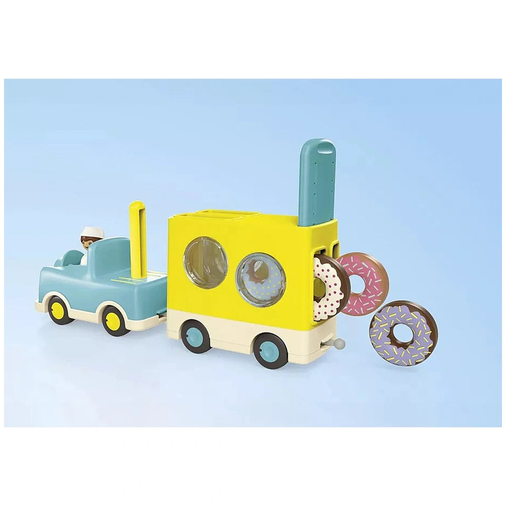 Playmobil Crazy-Donut-Truck toy playset featuring colorful plastic donuts and a vibrant truck design with multiple plastic co