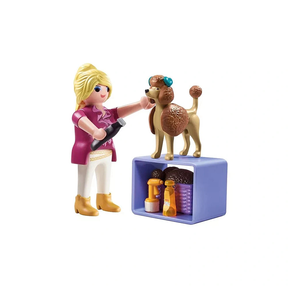Playmobil Dog-Groomer toy set featuring a plastic doll and dog, with blue collar and brown leash.