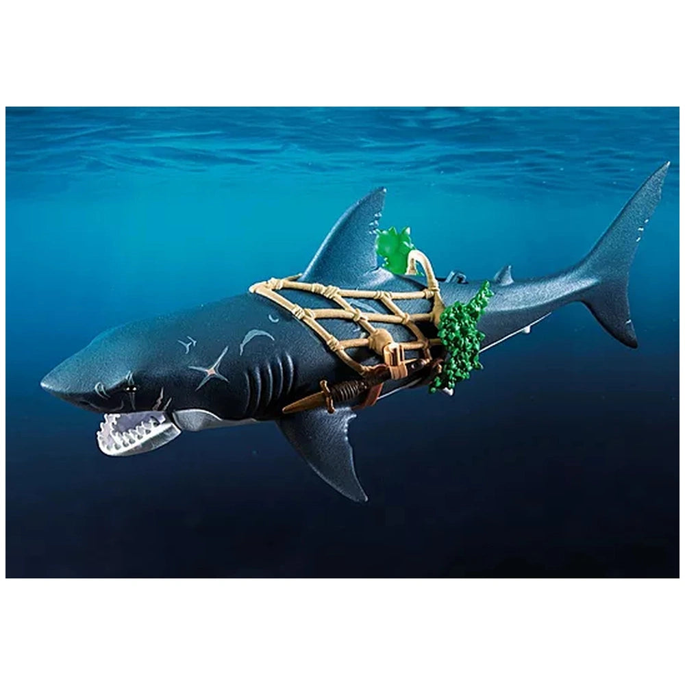 Giant shark toy playset in gray with green seaweed, set against a dark blue water background.