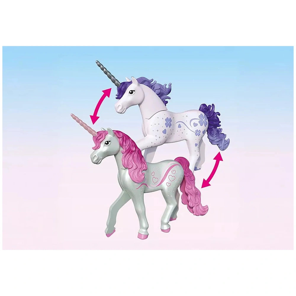 Playmobil Magical Unicorn Stable features two glossy unicorn figurines with pink and purple manes against a light blue backgr