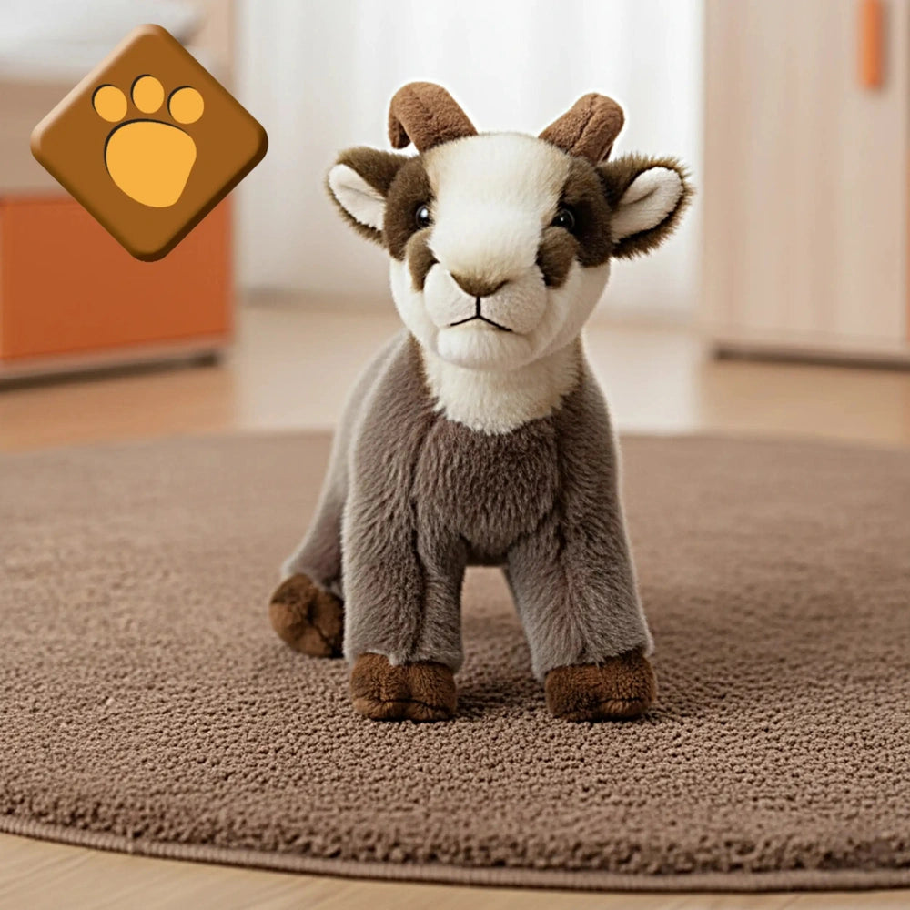 Rudy Little Mountain Chamois plush toy in gray and brown on a beige looped carpet, featuring horns and a white belly.