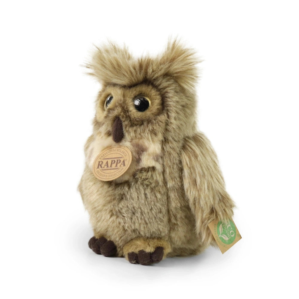 Plush eagle-owl toy in brown with lighter accents, featuring a tag that reads "RAPPA" and a green leaf symbol.