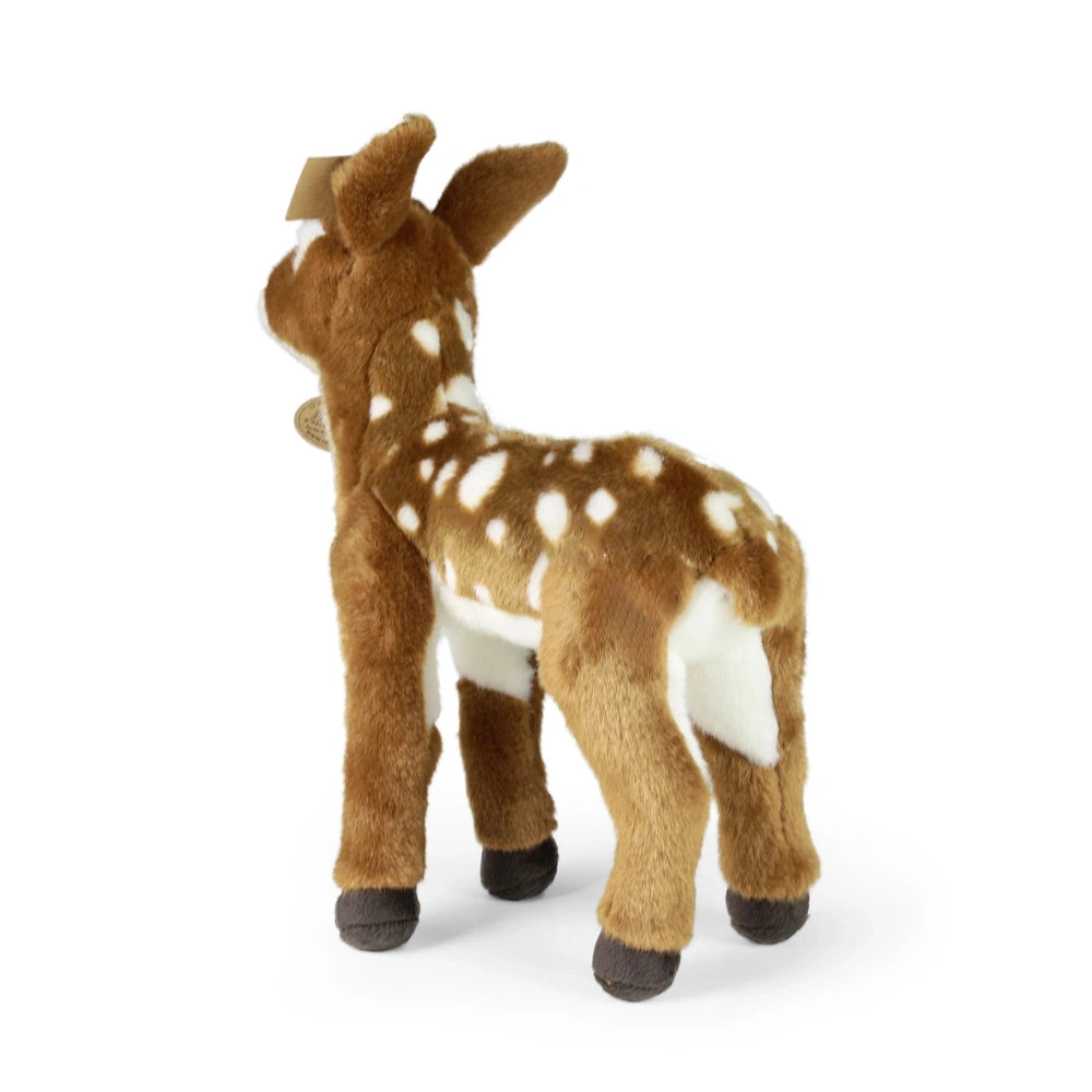 Plush fawn toy in soft brown and white fabric, standing upright against a light background, showcasing its natural features.