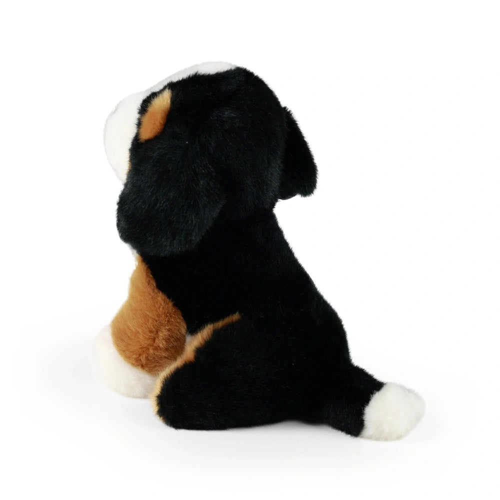 Plush mountain dog stuffed animal in black and white, sitting upright on a plain white background.