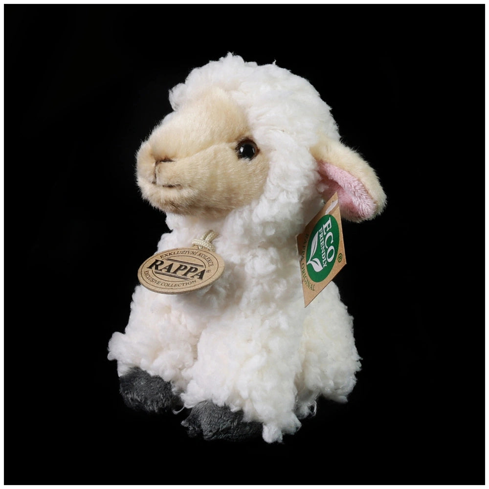 Plush sheep stuffed animal with a fluffy white body and eco-friendly tag, set against a black background.