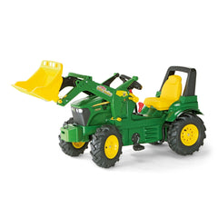 Rollyfarmtrac John Deere 7930 toy tractor features a green body, yellow scoop, and black tires against a white background.