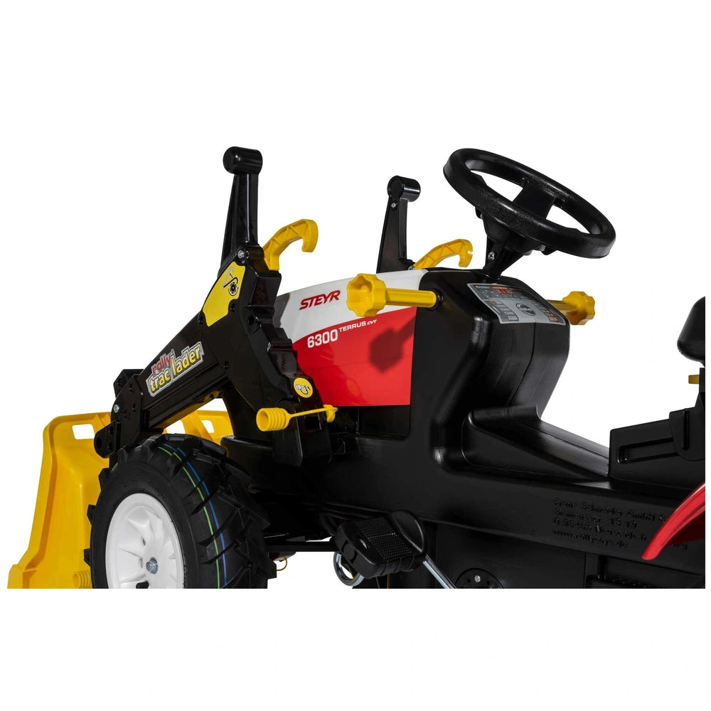 Rollyfarmtrac Premium II Steyr 6300 Terrus CVT riding toy features a black body with a prominent yellow handle and various me
