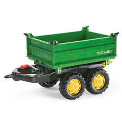 Green Rollymega utility trailer with textured flatbed, yellow-accented wheels, and "MEGATRAILER" branding on the side.