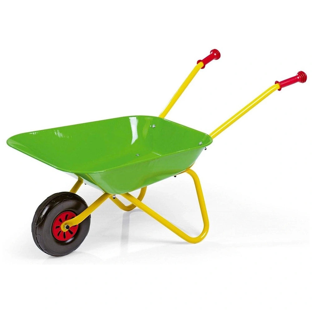 Green wheelbarrow with yellow handles and red wheels, made of smooth material, placed on a flat surface against a light backg