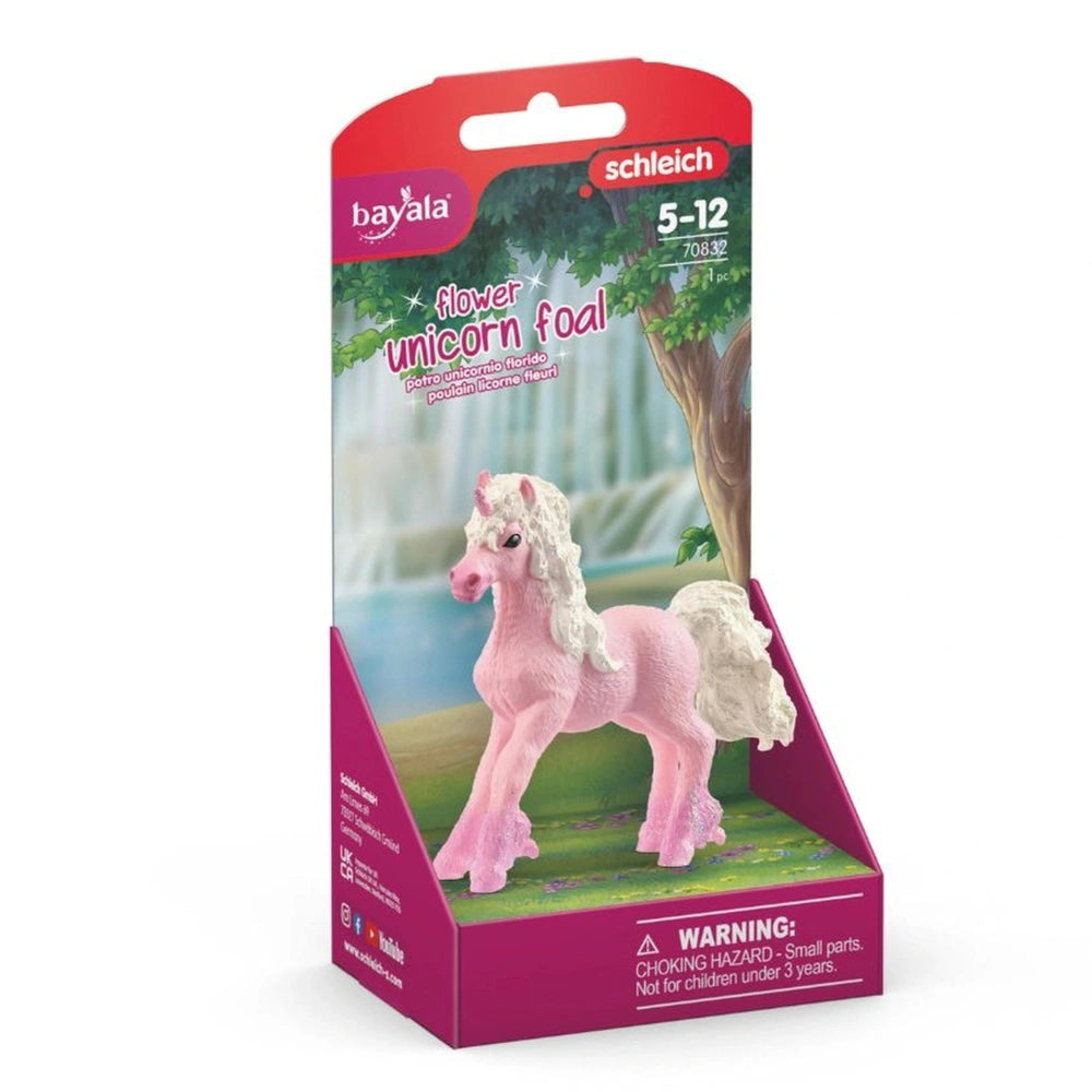 Bayala Flower Unicorn Foal toy in pink packaging with a clear window, featuring a unicorn on grass and a waterfall backdrop.