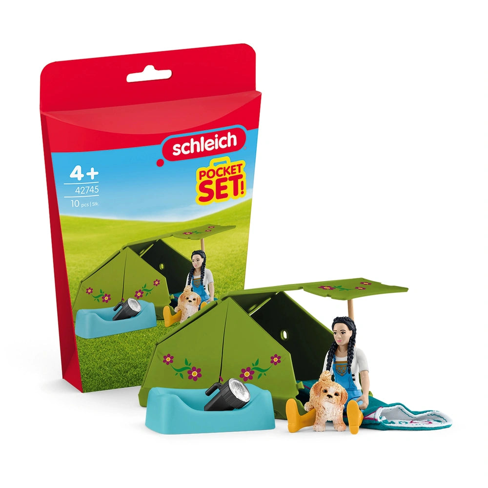 Schleich Camping Adventure set features a tent, a person, a dog, and a flashlight in colorful packaging with a clear window.