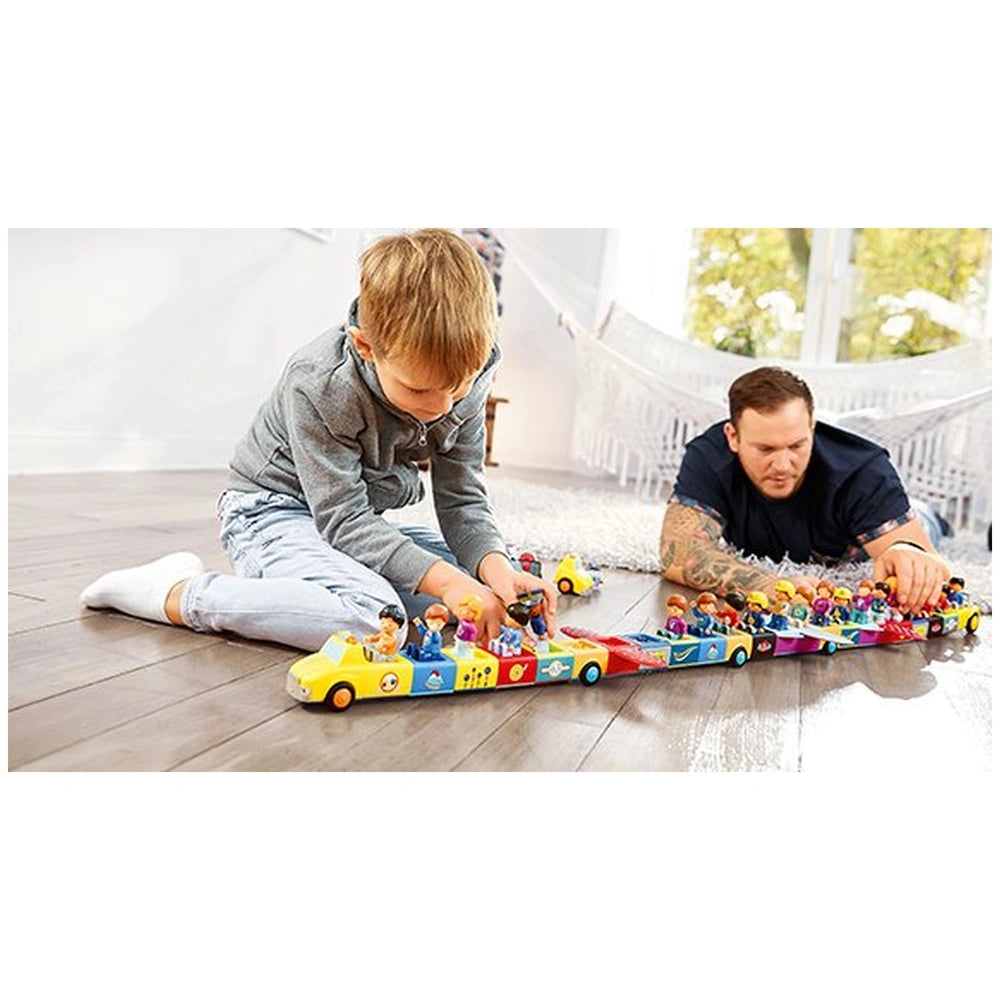 Siku Adam Addy Toddys construction set toys are being played with by a focused child on a light-colored carpet in a cozy room