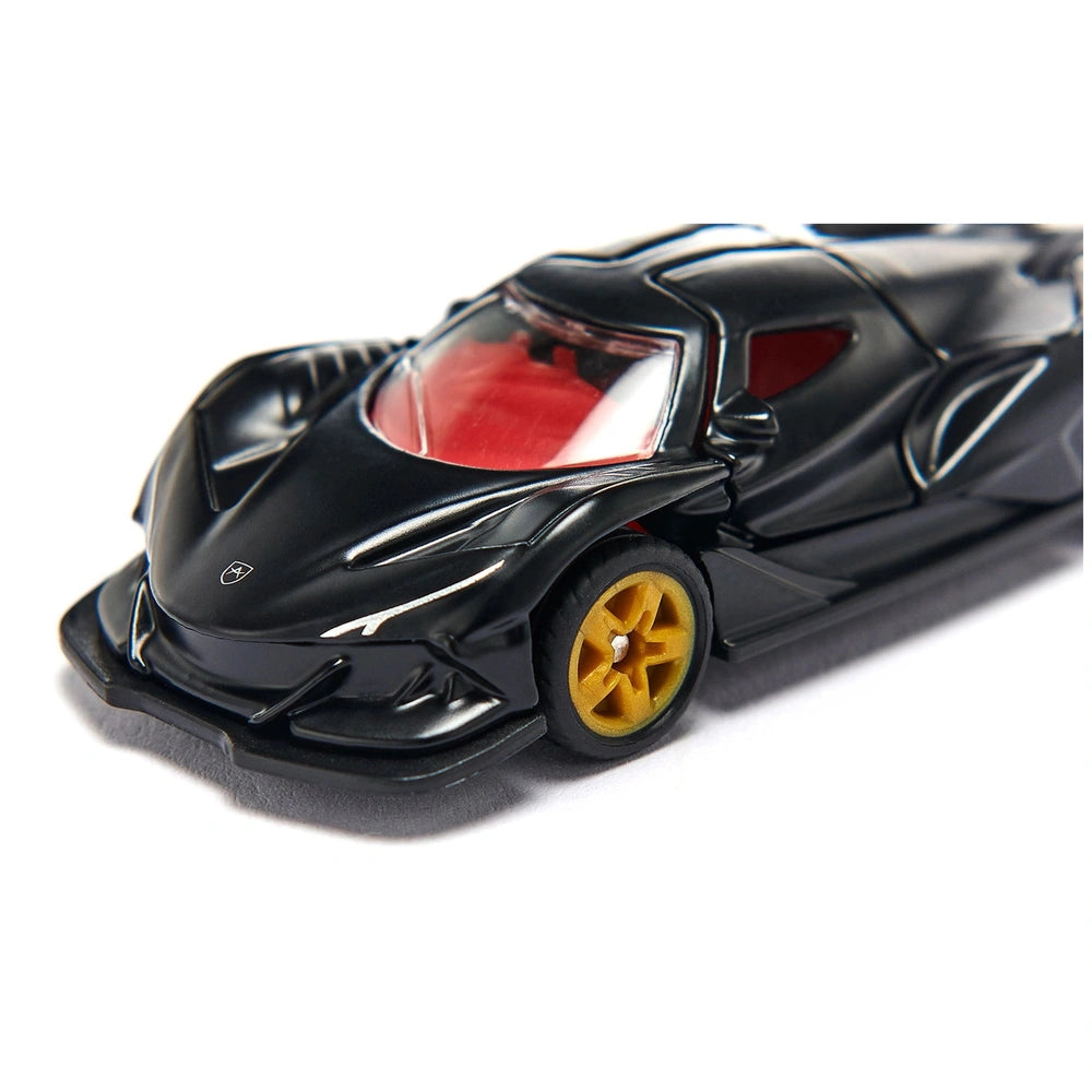 Black toy car with a glossy finish, red interior, and yellow wheels, displayed on a white surface.