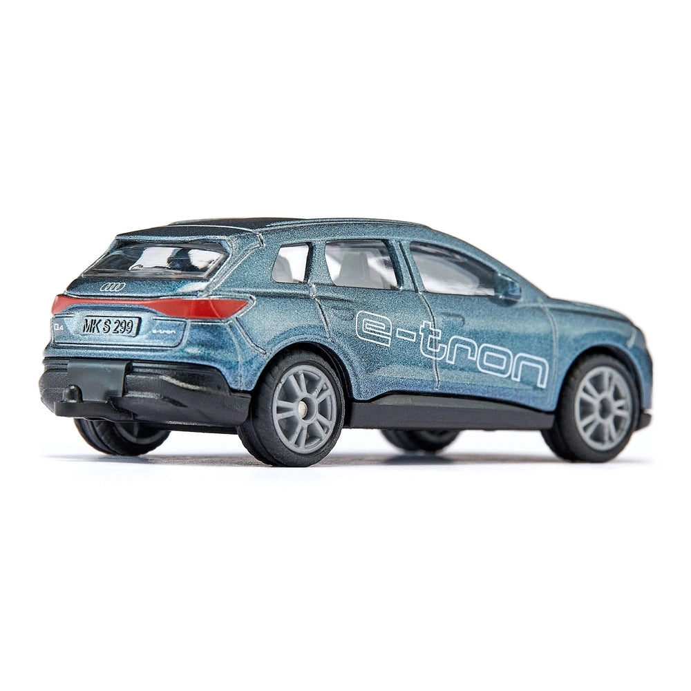 Audi Q4 e-tron model car in glossy blue with silver wheels, red details, and visible windows against a white background.