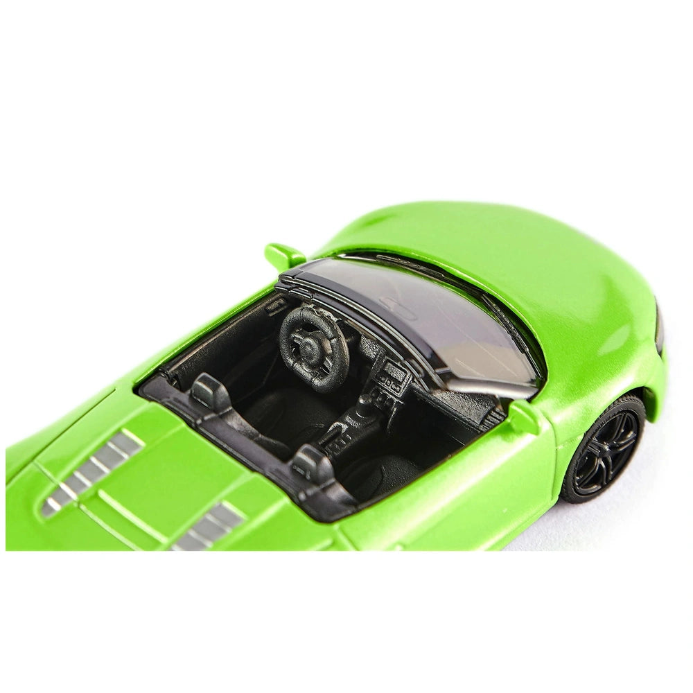 Green Audi R8 Spyder toy car with an open hood showcasing the interior, set against a white background.
