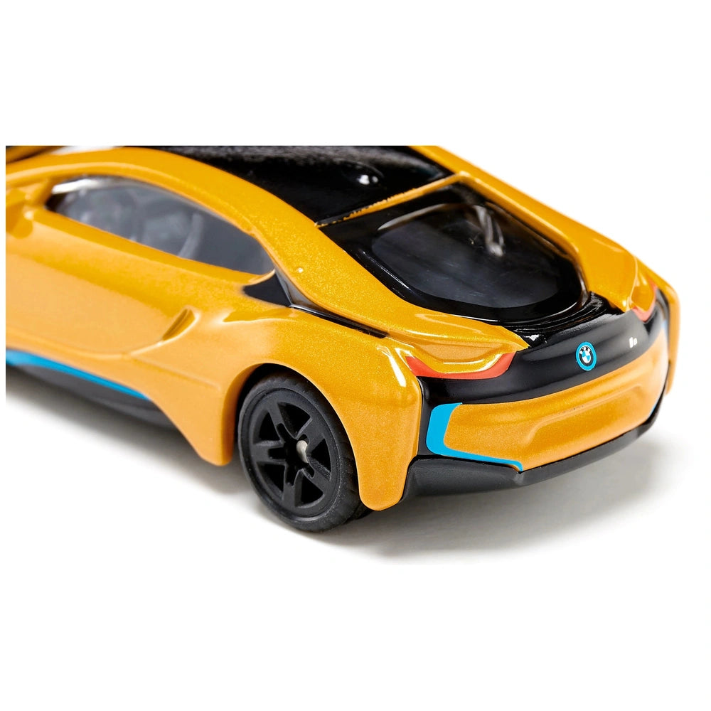Siku BMW I8 toy car features a bright yellow body, black wheels, and a glossy finish with a blue detail on the side.