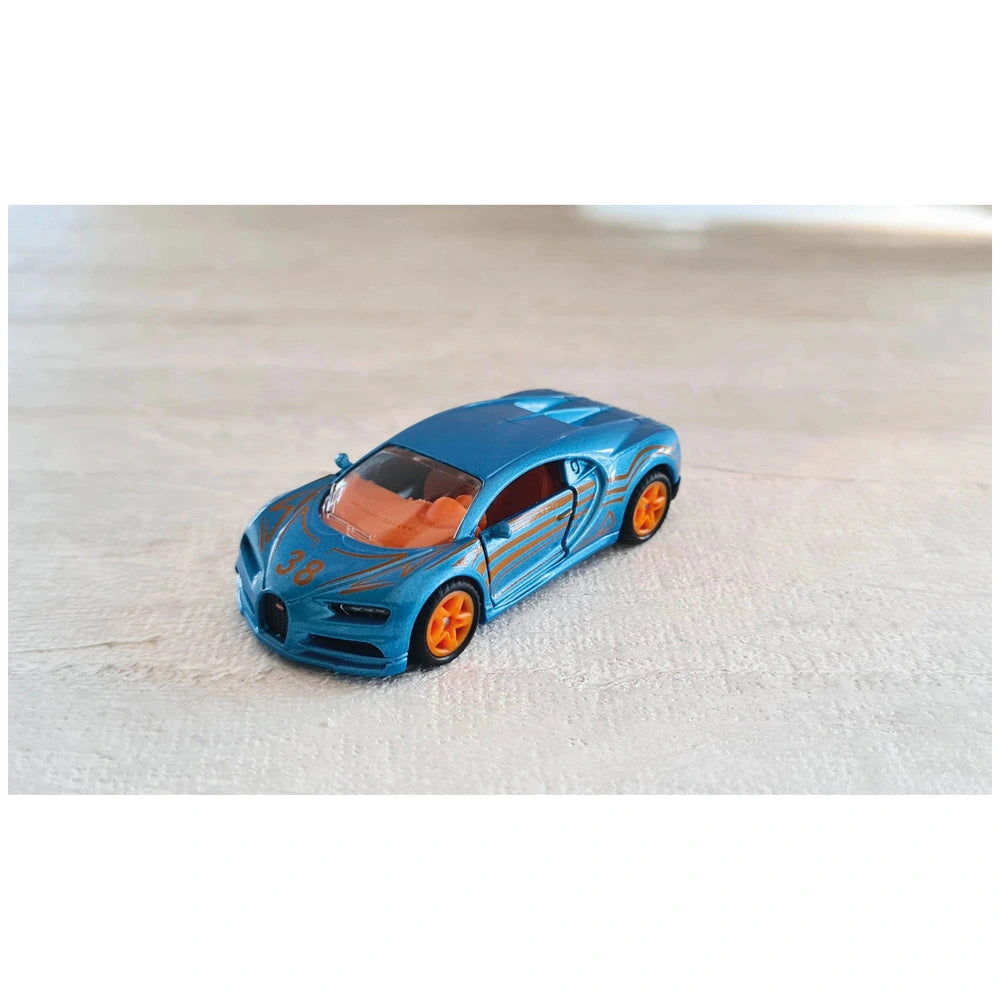 Siku Bugatti Chiron toy car in blue with orange accents, displayed on a light-colored surface, showcasing its sporty design.