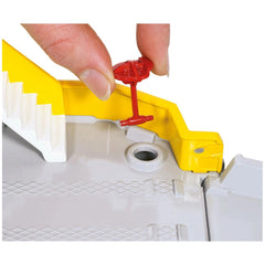 Siku car ferry toy playset features a red plastic piece being pressed by a hand in front of a yellow component.