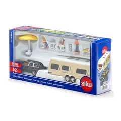 Toy car and caravan playset in blue and white packaging, featuring camping accessories and vibrant colors.