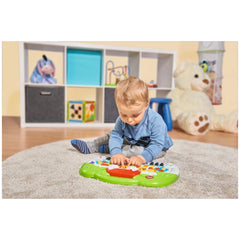 Simba ABC Animal Keyboard - Young child playing with a colorful toy keyboard on a beige carpet in a bright playroom.
