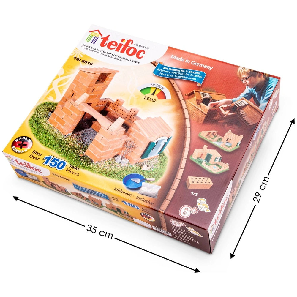 Teifoc Castle-House building set box features vibrant orange and yellow colors, showcasing model components and a child figur