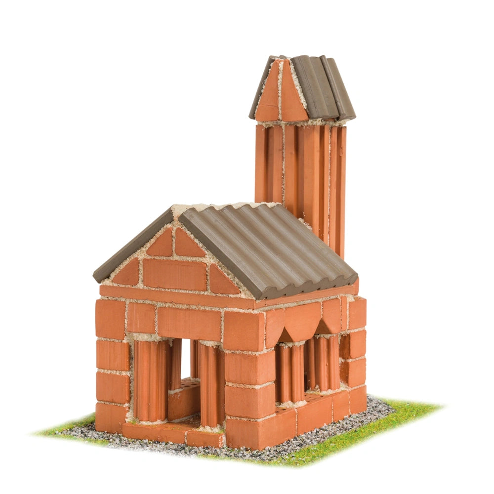 Teifoc Church features a red brick structure with a pointed roof, set on a gravel base, showcasing detailed craftsmanship.
