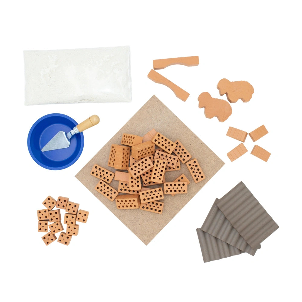 Teifoc sheepfold set includes various wooden components, scissors, and a blue bowl arranged on a surface.