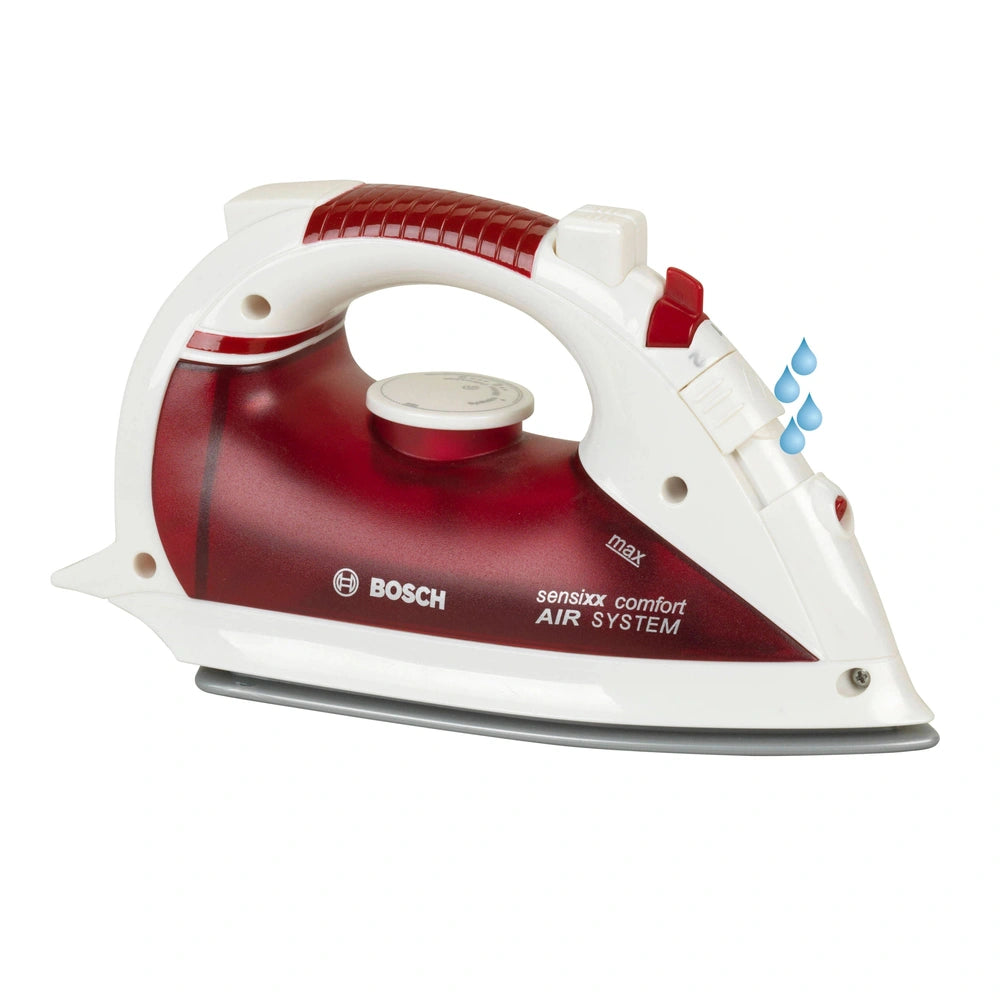 Theo Klein Bosch iron in red and white with visible brand name, buttons, lights, and a power cord for pretend play.