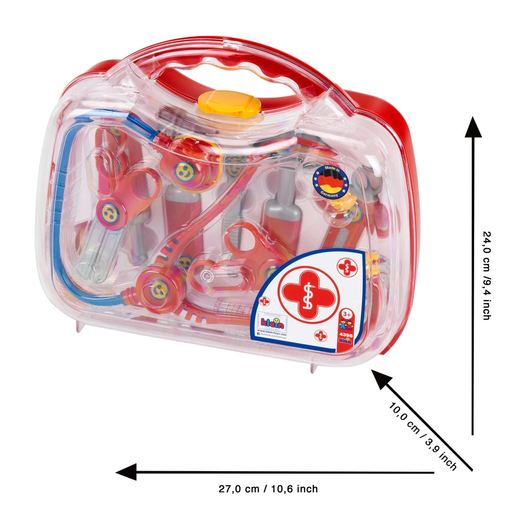 Theo Klein Doctor Case features a clear plastic package with a red handle, containing scissors, tweezers, and pliers.