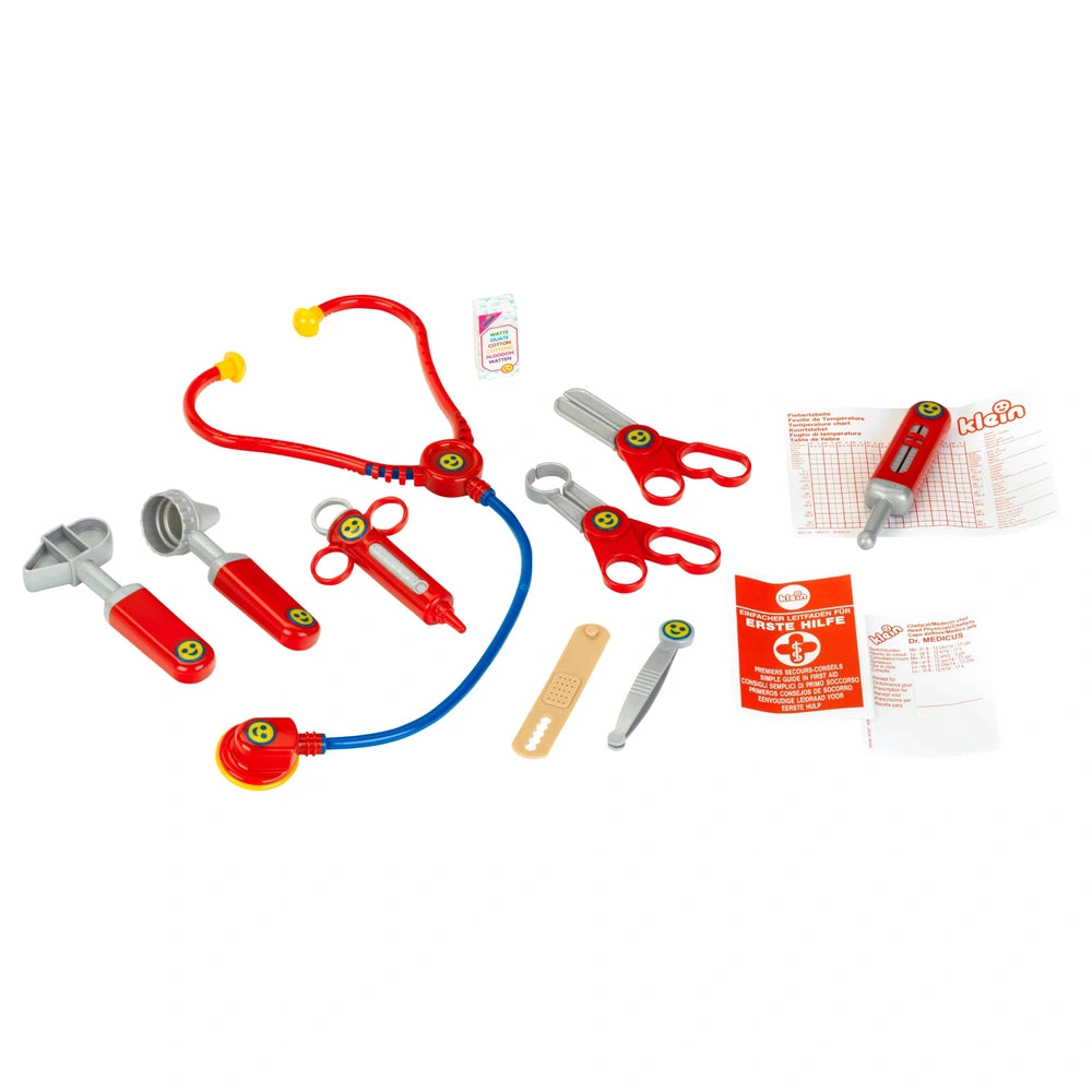 Theo Klein Doctor Case with red stethoscope, scissors, thermometer, bandages, and instruction manual in a transparent layout.