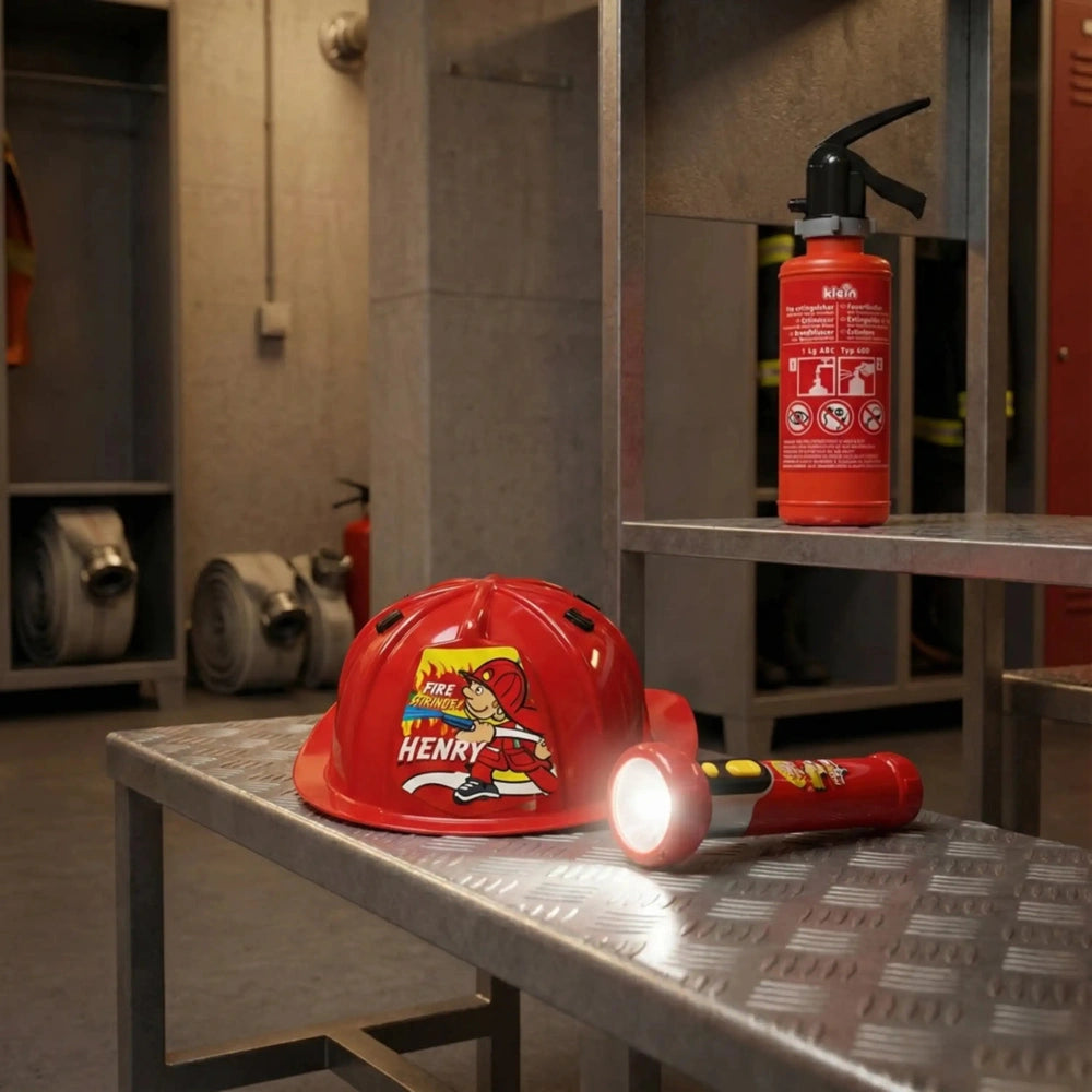 Theo Klein firefighter set includes a red helmet with "FIRE HENRY" and a red fire extinguisher with black symbols.
