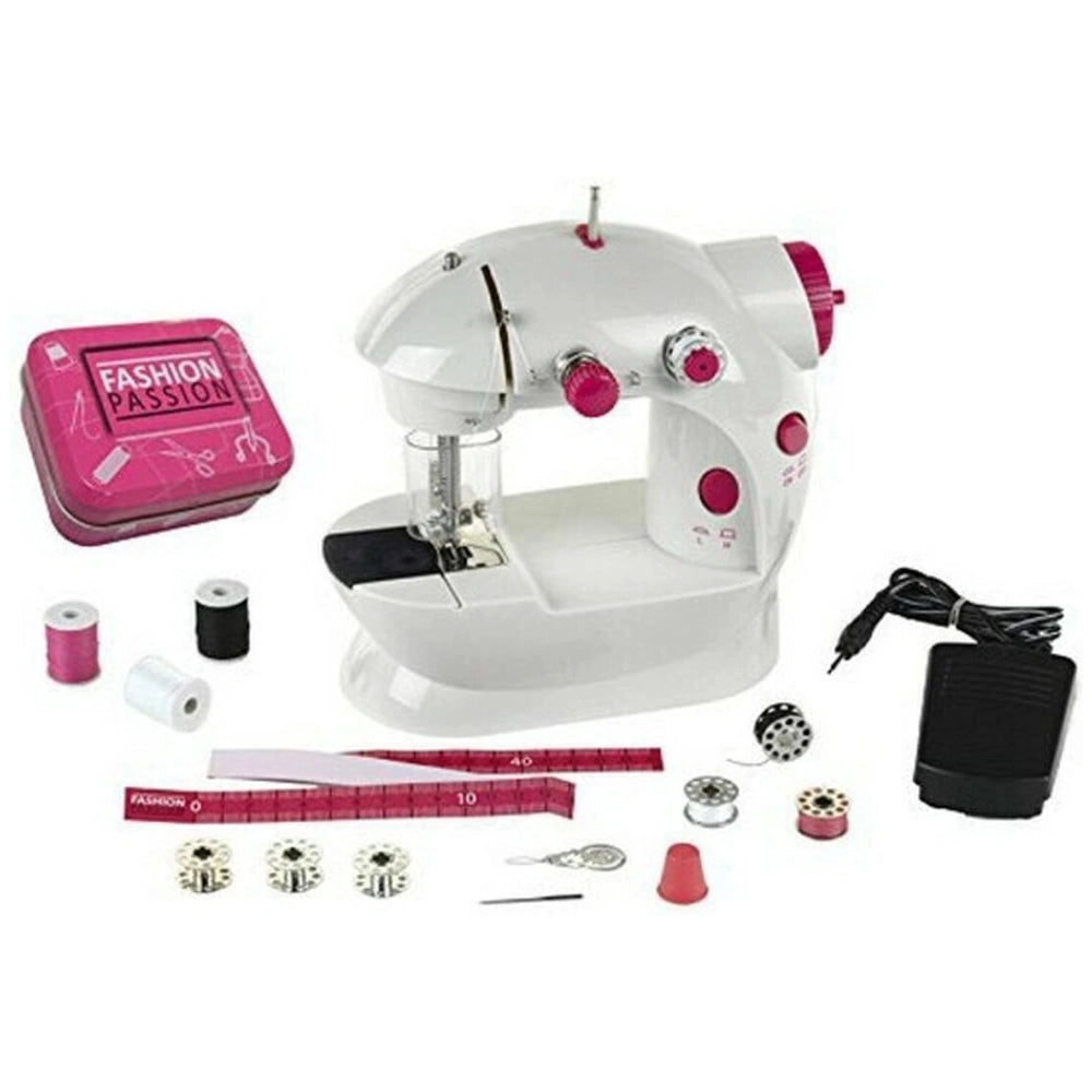 Theo Klein kids sewing machine in white matte finish with red buttons, clear plastic components, and pink glossy box.