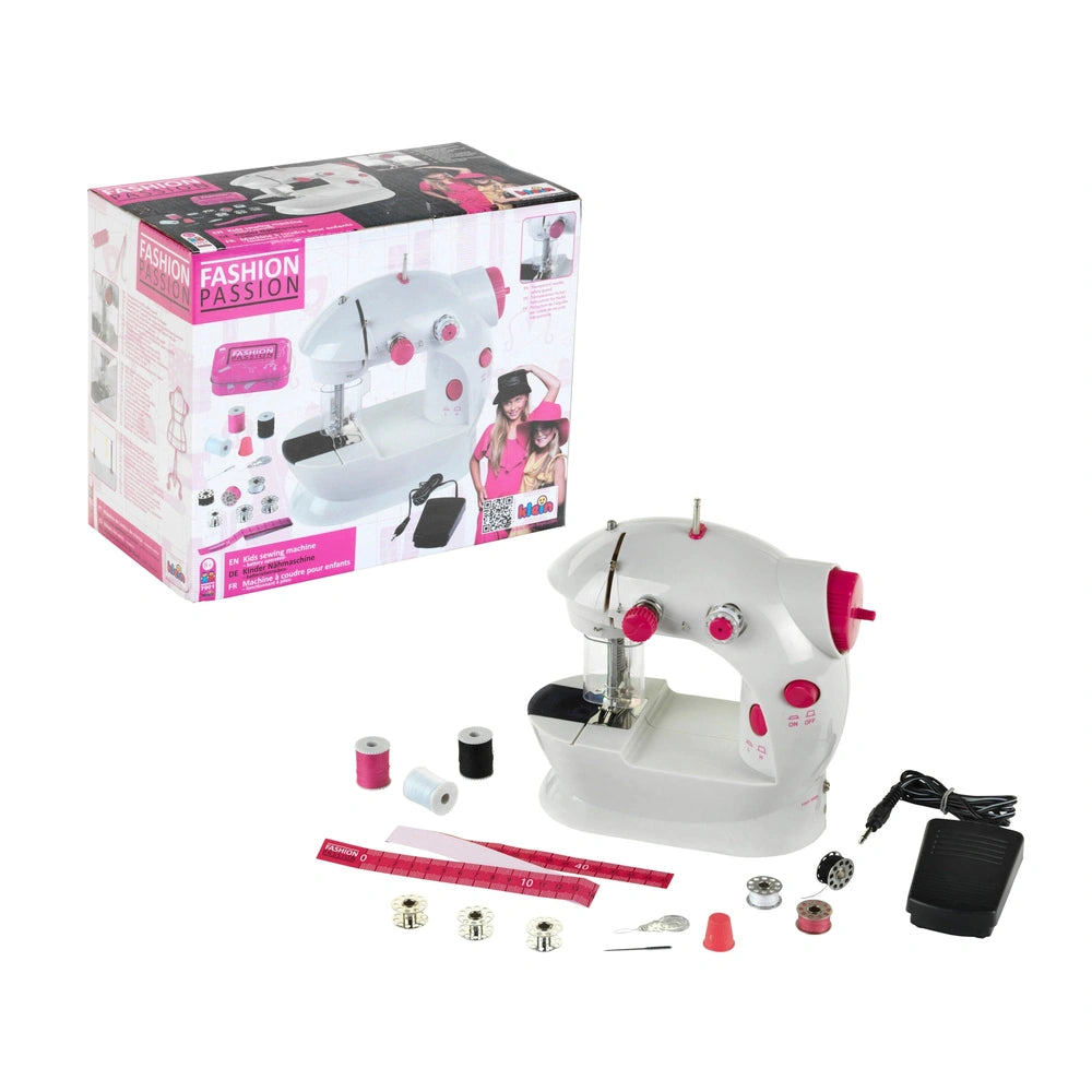 Theo Klein kids sewing machine packaging in pink and white, featuring a clear window and visible sewing accessories.
