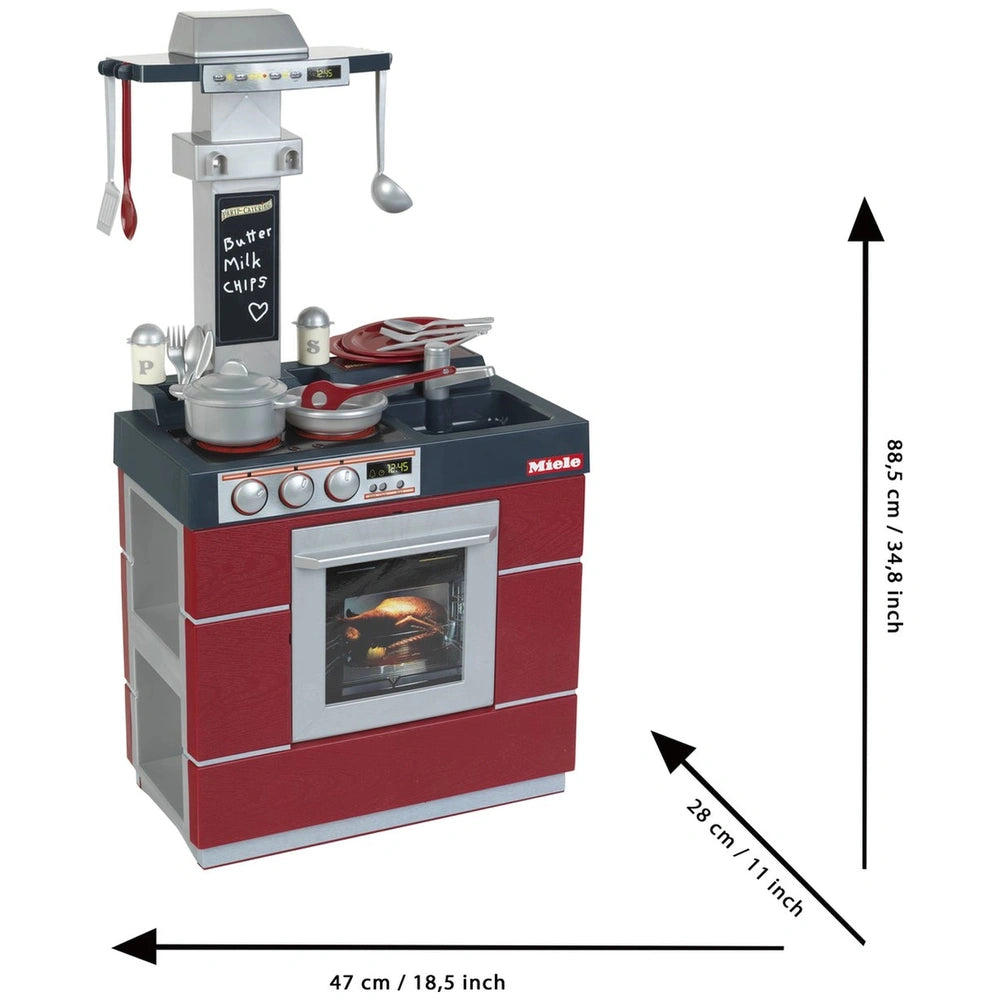 Theo Klein Miele Kitchen Compact features a red metallic oven with silver utensils, pots, and measuring tools for pretend pla